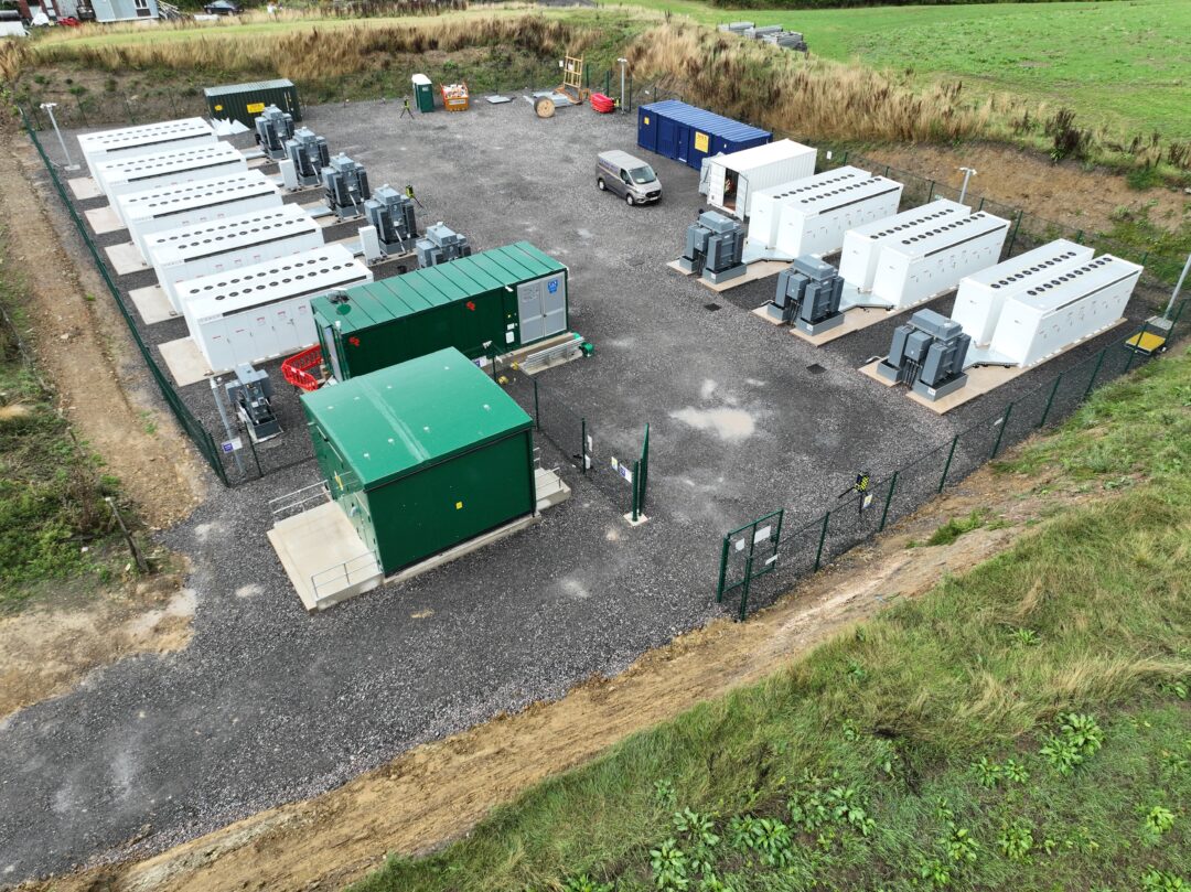 tesla megapack batteries in a field