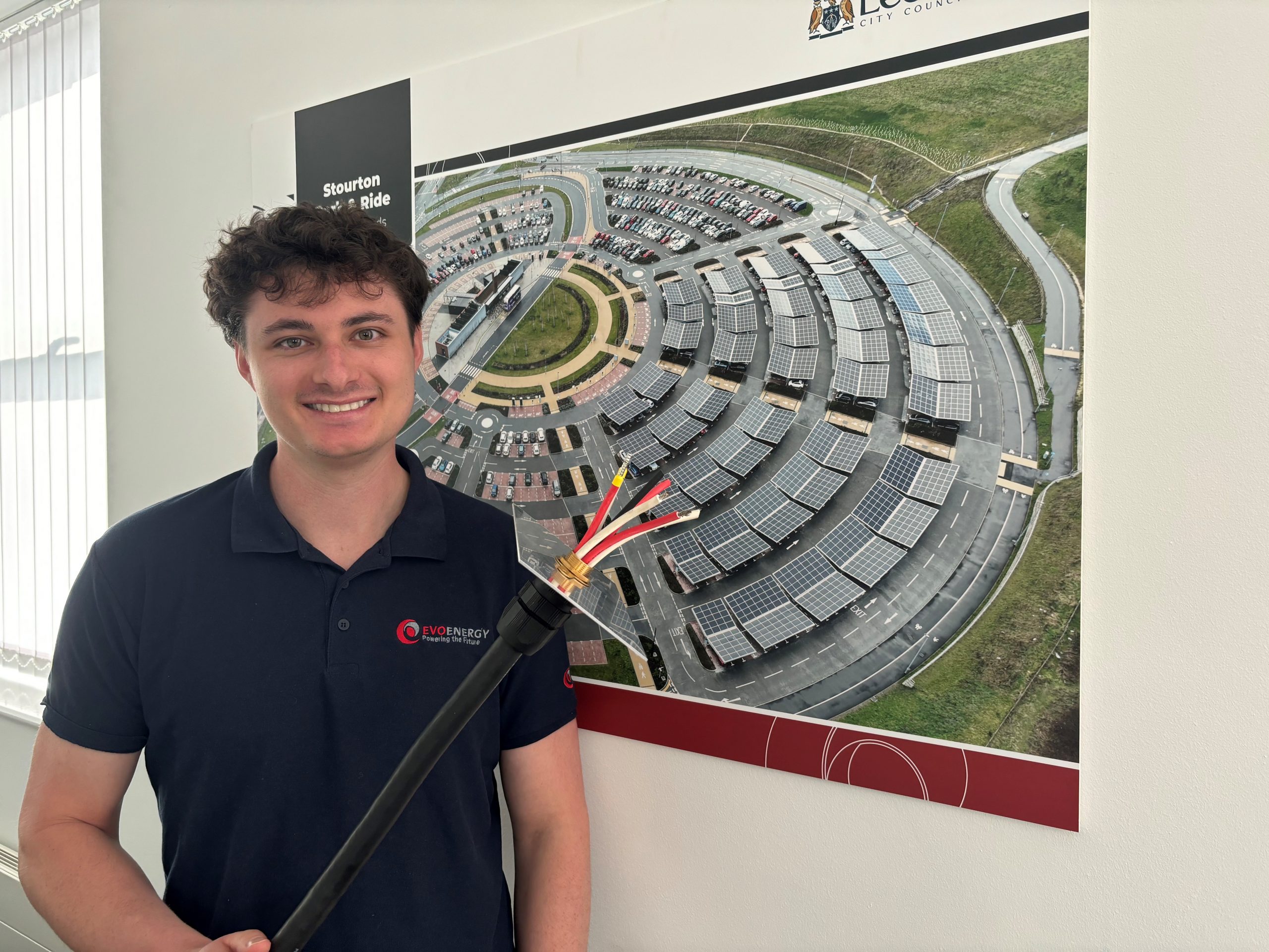 evo energy engineer holding a fire safe cable for solar pv