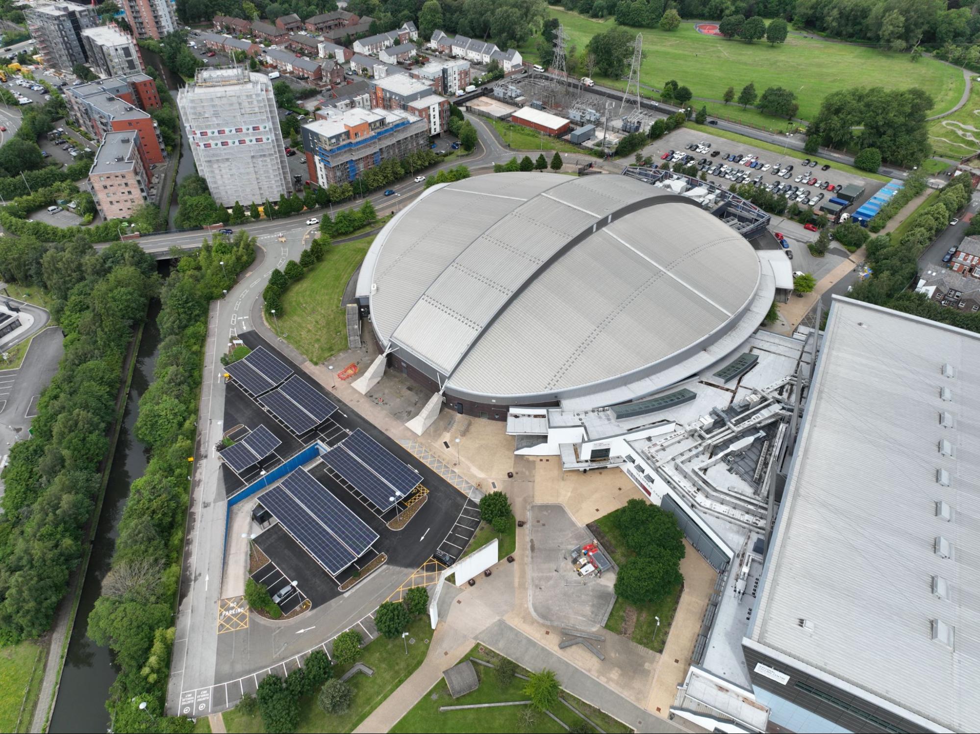 erial view of a stadium featuring solar panels, showcasing sustainable energy solutions in sports facilities