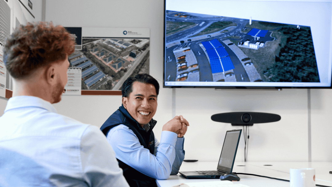 EvoEnergy team members smiling during a project handover review