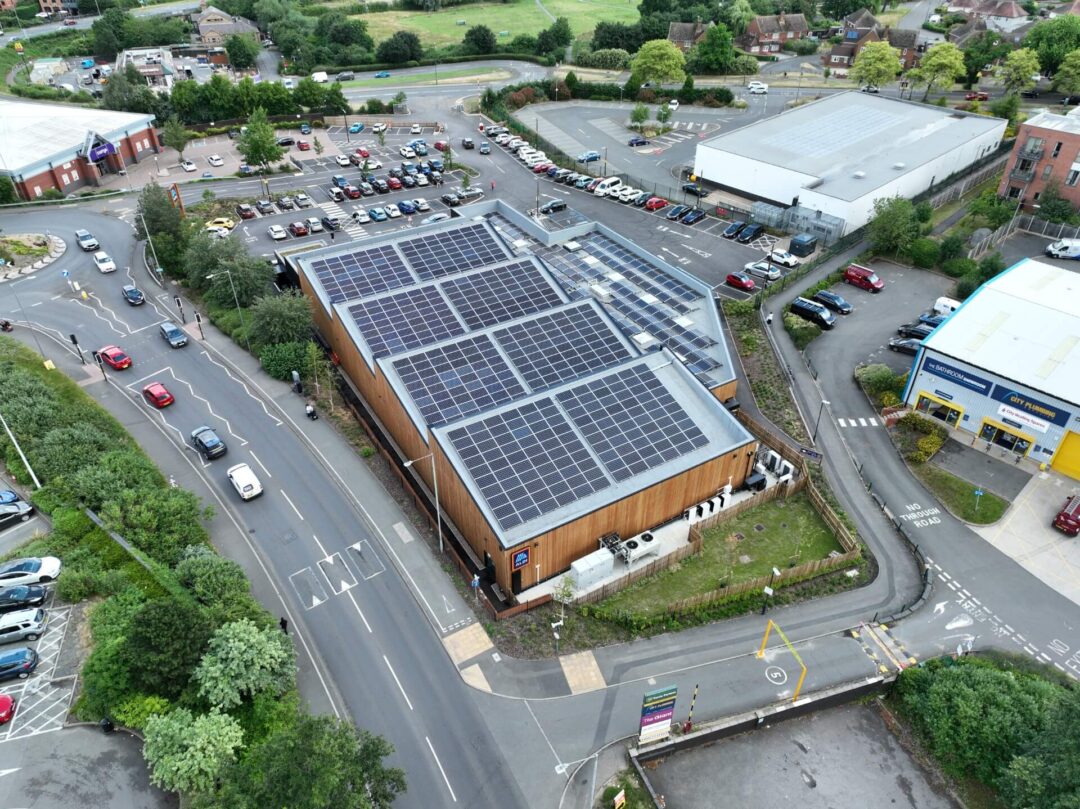 solar panels installed on top of an eco friendly aldi supermarket