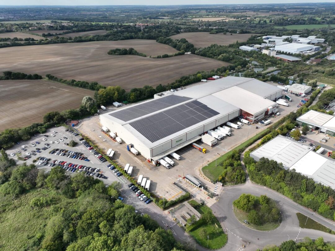 Solar panels adorning the roof of a food production commercial building