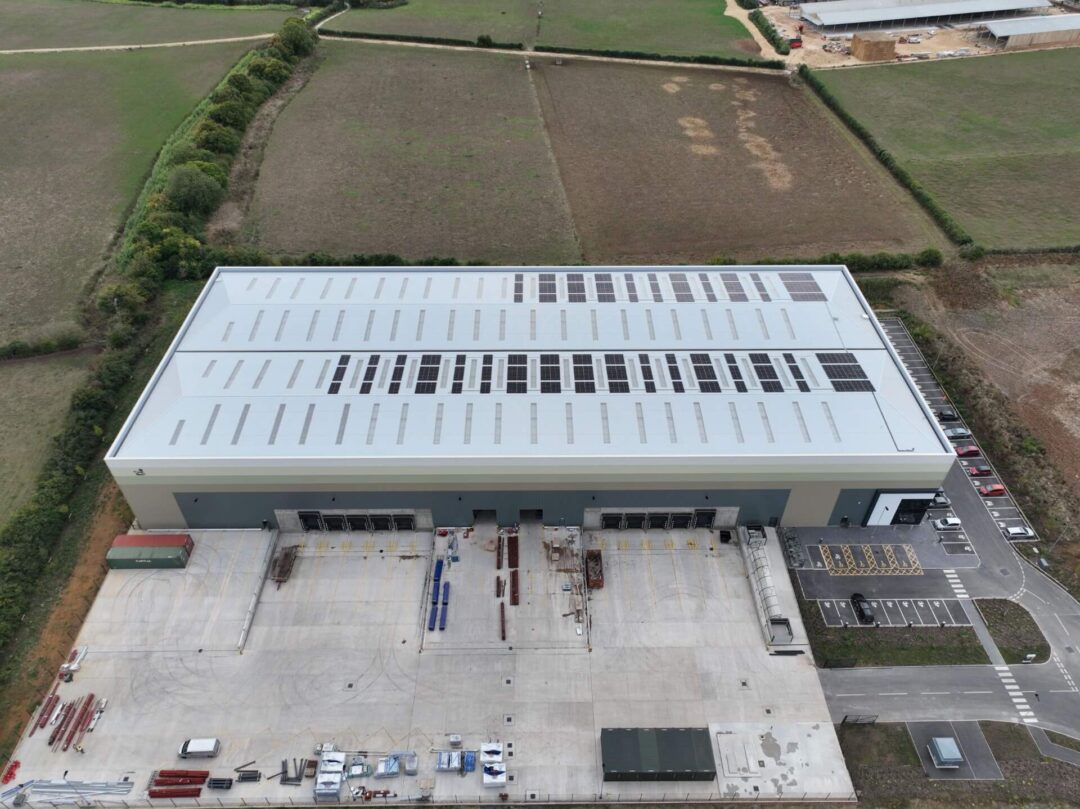 Solar panels on half of warehouse roof