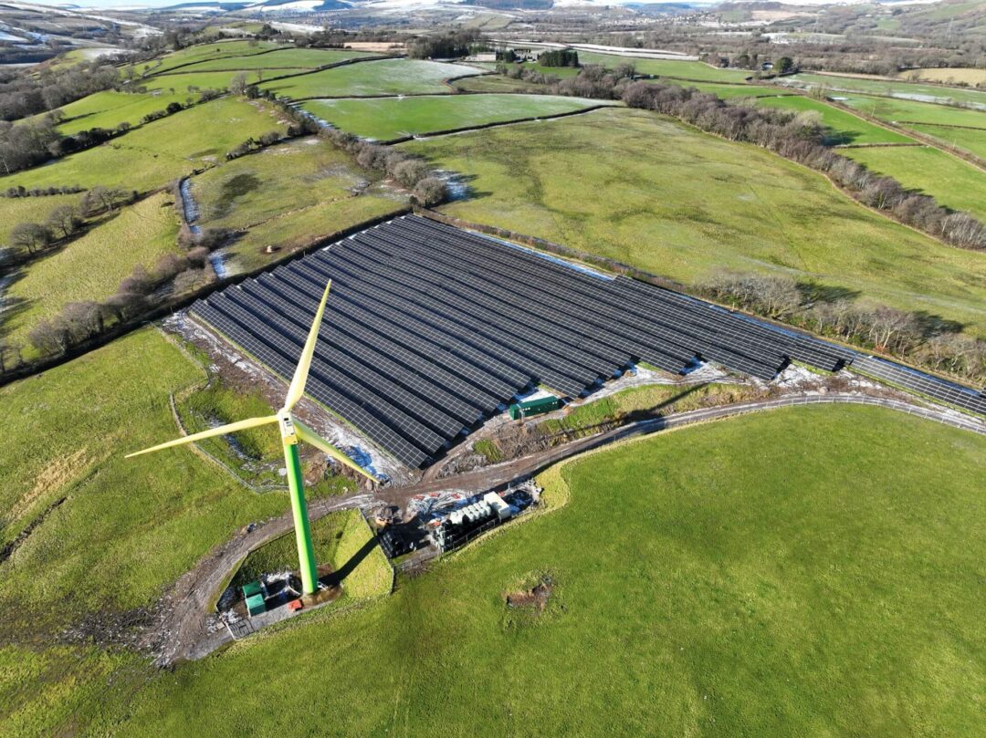 Sunny expanse meets breezy expanse Solar farm adjacent to wind farm.
