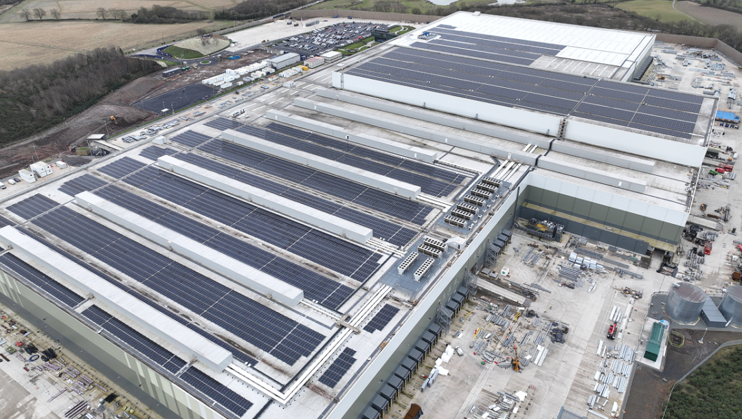 Aerial view of Aldi Bardon distribution centre rooftop solar panels across a large commercial building