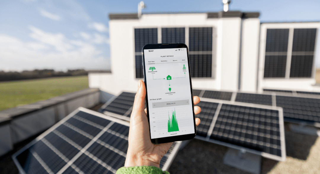 Building energy management system displayed on smartphone monitoring solar generation, grid supply and onsite electricity consumption.